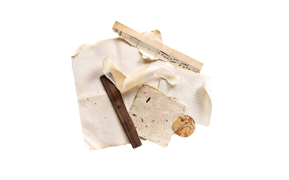 Assortment of old papers, sheet music, and wooden stick solated on transparent background