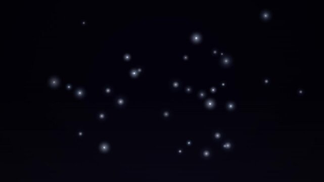 Glowing particle loop creates a soft bokeh effect on a black background.