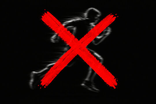 A bold red X mark over a blurred figure in a running pose.