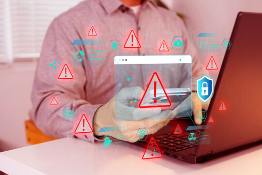Digital threat symbols hover near devices as person checks security and concerned about security threats
