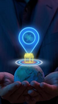 Close-up vertical shot of hands holding world globe model with glowing retail store location pin. Global commercial branch expansion, international marketplace mapping, and franchise idea concept.