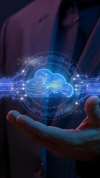 Close-up vertical shot of hands holding glowing cloud computing icon with orbiting data rings. Enterprise cloud hosting infrastructure, virtual server storage, and network database system concept.