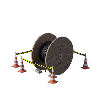 Large wooden cable spool surrounded by orange traffic cones and caution tape.