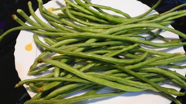 Fresh yardlong beans arranged on a plate