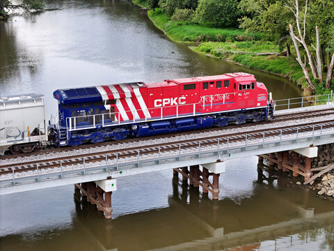 Savanna, Illinois September 8, 2026 CPKC 250 America250 Locomotive &mdash; Semiquincentennial Commemorative Freight Engine crossing a cement bridge
