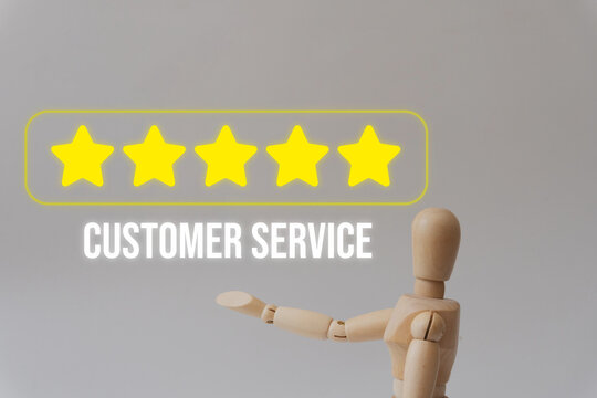 Wooden mannequin points to five-star rating. Text reads 'Customer Service'. Suggests excellence in support or satisfaction. Ideal for business, marketing, or service industry visuals