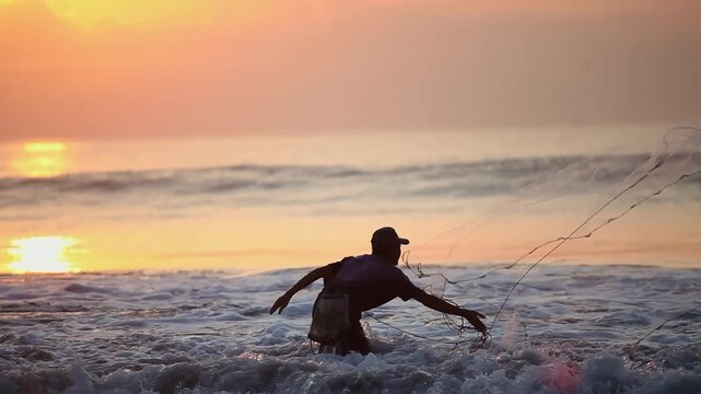 Local Fisherman Throwing Cast Net into Sea Waves at Golden Hour