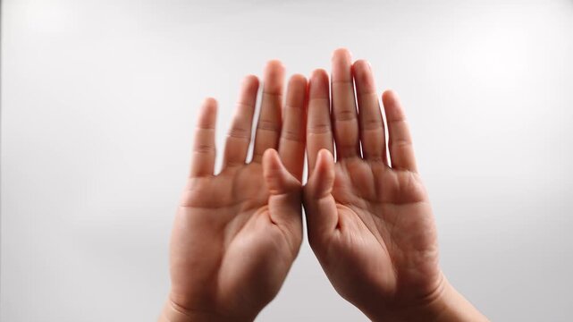 To sign "open" in American Sign Language (ASL), hold both hands with your palms facing forward or toward your body, then move them apart to mimic opening a door or a barrier