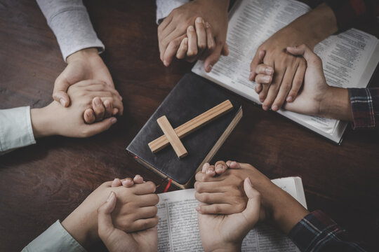 This Christian community prayer scene represents religion, spirituality, trust in God, encouragement, and heartfelt prayer among friends.