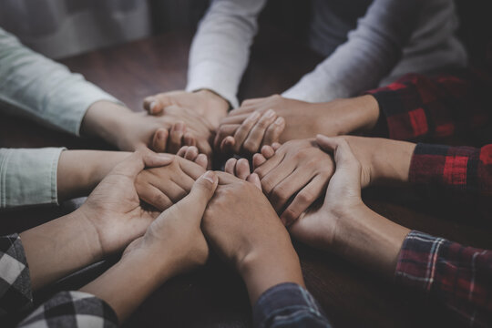 Clasped hands symbolize unity, love, support, and devotion in a peaceful moment of worship, reflection, and shared belief.