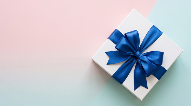 Minimal White Gift Box with Blue Ribbon on Pastel Background with Copy Space