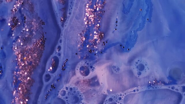 Shimmer ink. Acrylic oil bubbles. Defocused blue color water droplet glitter sequins round pigment spill on abstract bright art background.
