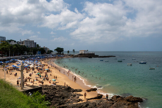 Porto da Barra Beach in Salvador, featuring calm seas, clear waters, and a historic setting that highlights coastal beauty, the tropical climate, and Bahian charm.