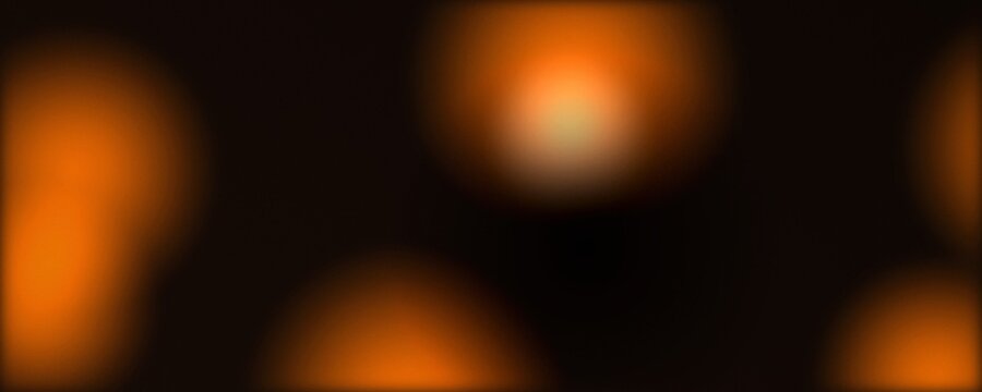 Warm orange bokeh lights on black background, soft glowing amber lens flare circles, abstract golden light leak texture for cinematic overlays and festive holiday designs
