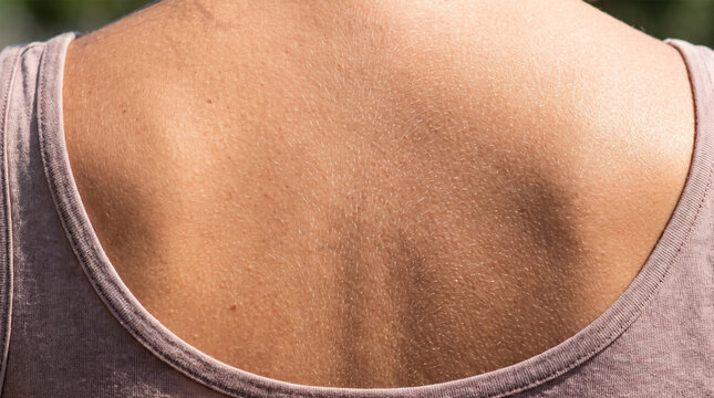 Close Up Back View Shot of Woman Upper Back and Shoulders in Pink Tank Top