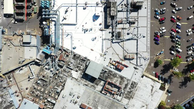 4K aerial drone footage of large aerospace metal manufacturing and casting factory in Portland, Oregon, USA, showing production buildings, machinery, pipes and industrial infrastructure