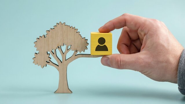 Sustainable growth concept with hand holding a human symbol beside a growing tree representing people, nature, and development