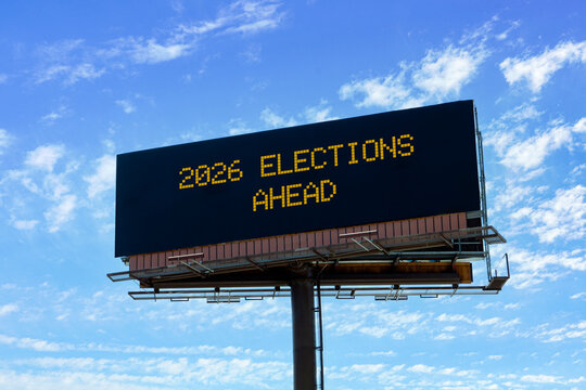Electronic billboard with mid-term elections ahead message.