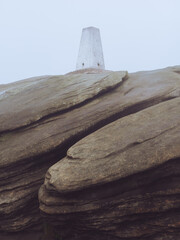 The trig point of Back Tor on Derwent Moor, Peak District, sat a top of wind eroded grit stone  © Dave Harrison-Ward