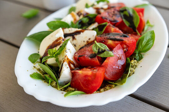 Mediterranean Vegetarian Salad on Wooden Table Background