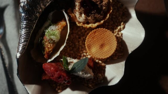 Artistic dessert arrangement presented on a decorative seashell platter