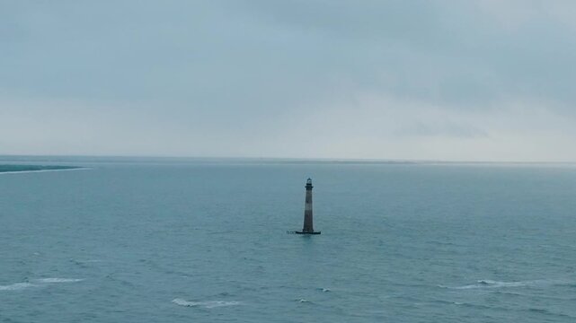straight view of morris island lighthouse in South Carolina near Folly Beach in the early misty mornings heading towards the lighthouse