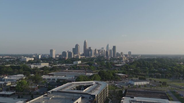 Drone footage of downtown Charlotte aka uptown overlooking near camp north end overlooking parking decks during early sunset hours