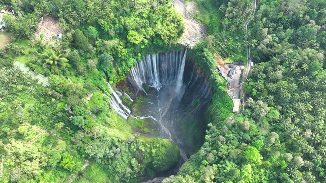 Aerial Top Down Orbit of Tumpak Sewu Waterfall in East Java Indonesia Surrounded by Tropical Forest