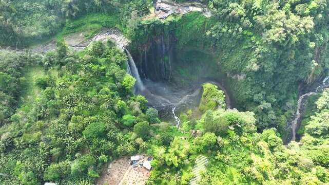 Breathtaking Aerial View Of Tumpak Sewu Waterfall (Coban Sewu) On The Border Of Lumajang Regency And Malang Regency In East Java, Indonesia.