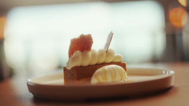 Close-up of a layered dessert with fresh strawberries and cream