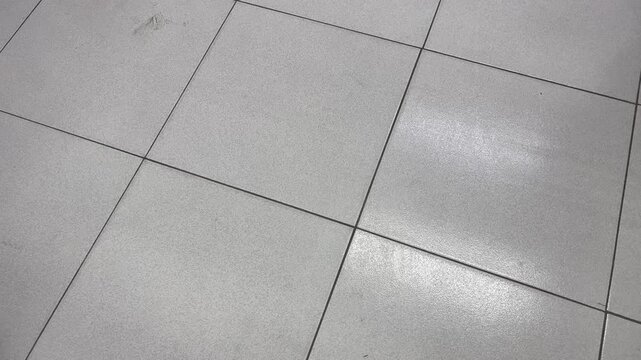 White Ceramic Tile Floor with Bright Soft Light Reflection