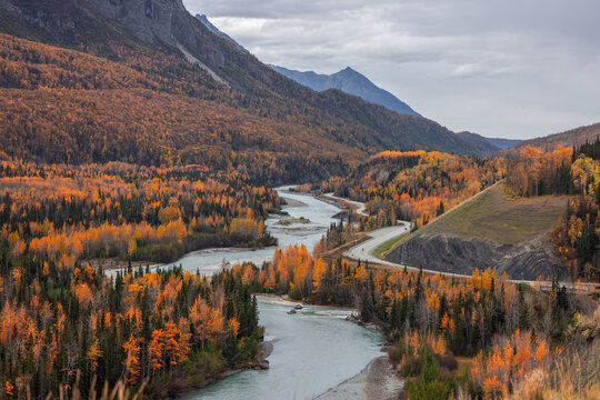 Alaskan landscape with winding river and autumn foliage