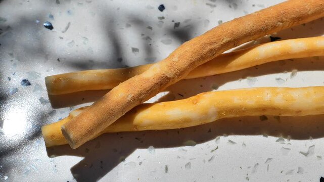 dental care.natural miswak sticks with decorative leaf shadows. Eco-friendly oral hygiene accessory made from Salvadora persica. 4k footage