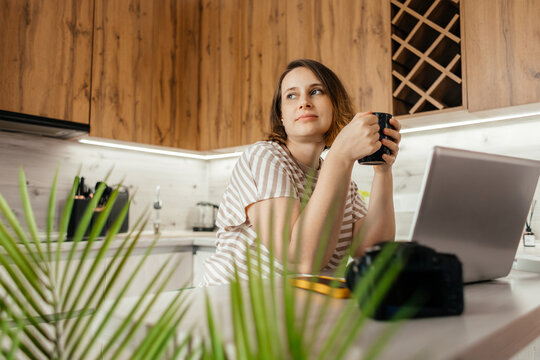 Woman photographer take coffee break during remote work