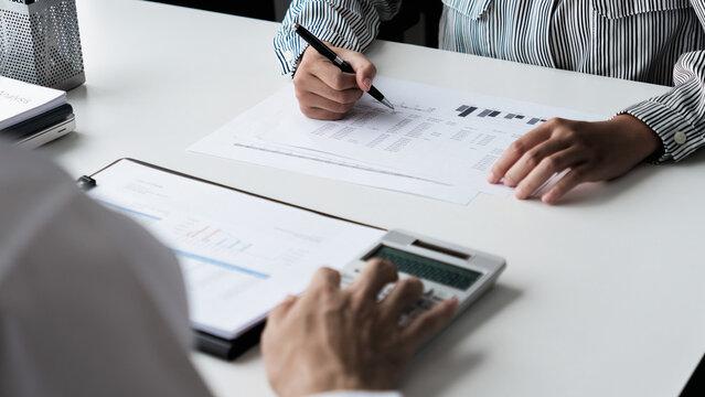 Financial inspector calculating a numbers in office room
