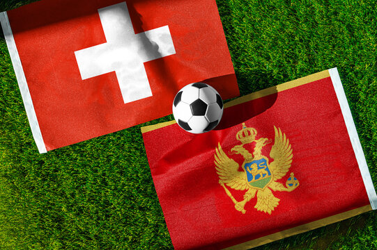 Switzerland vs. Montenegro football match. National flags on green grass with soccer ball in the middle. Football background for international match.