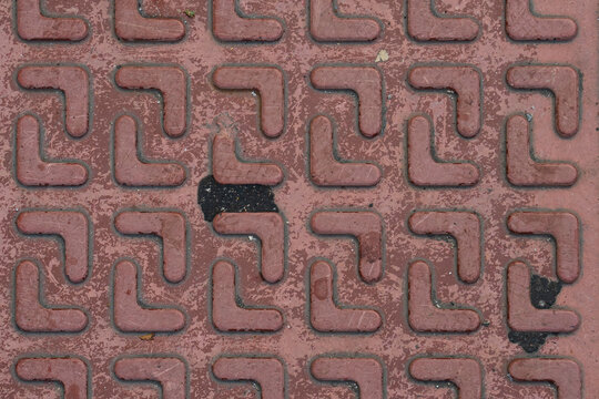 Red anti-slip tactile paving tile texture top view pattern