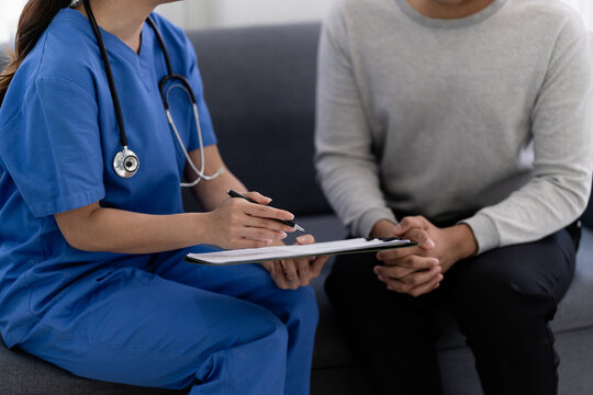 doctor discusses treatment options with a patient in a clinic visit