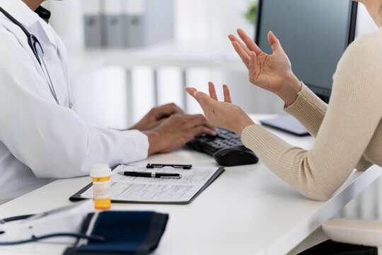 physician provides medical advice to a patient in a clinic consultation