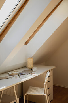 Scandinavian Attic Workspace Setup Under Roof Window