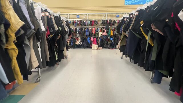 Thrift store clothes displayed gimbal walk trough