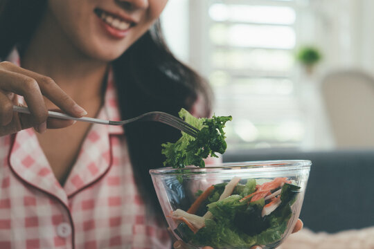 Woman enjoying life at home, promoting healthy eating, wellness, and a balanced lifestyle. Concept of natural nutrition, mindfulness, and modern healthy living.