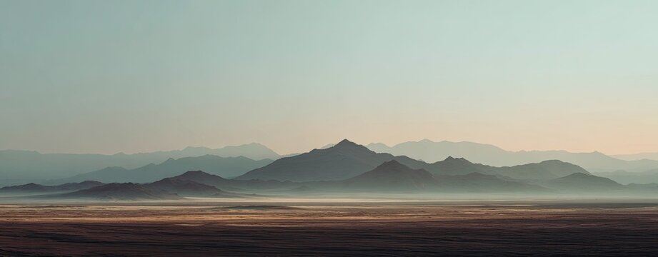Misty desert mountains at dawn
