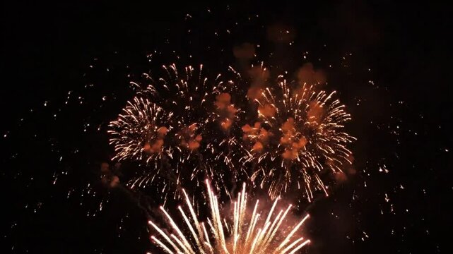 Spectacular Fireworks Display Illuminating the Night Sky with Vibrant Colors and Explosive Patterns During a Festive Celebration