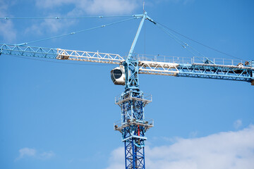 Construction Tower Crane Against Clear Blue Sky © Zhaorui