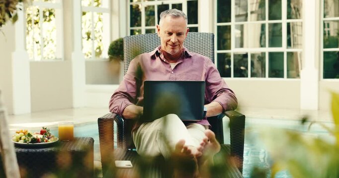 Laptop, typing and mature man in hotel for travel blog, online article and review for remote work. Freelancer, hospitality and person on computer for research, copywriting and report for tourism