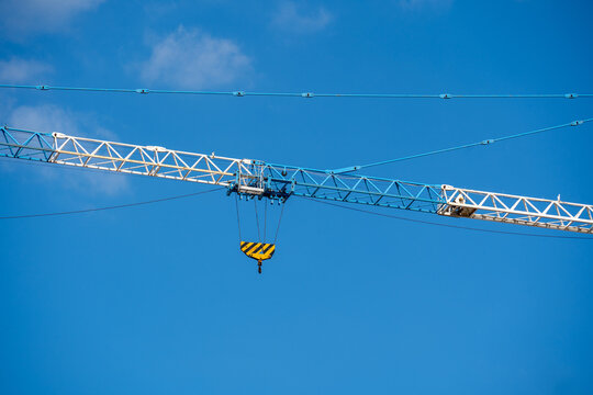 Crane Jib with Hook Block Against Clear Blue Sky
