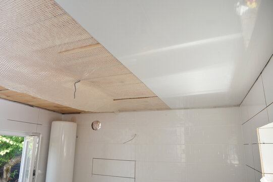 PVC Ceiling panels installation in house bathroom
