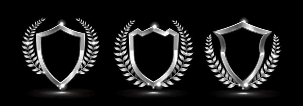 Elegant silver shield with decorative laurel leaves isolated on black. Vector realistic illustration of classic emblem design with luxury award elements, decoration for champion certificate and medal