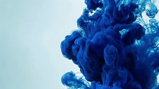 Indigo Ink Billowing Through Water Abstract Motion Background